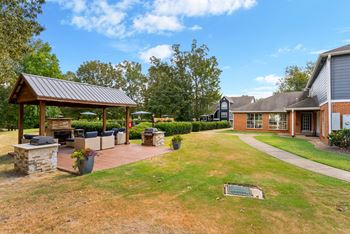 Outdoor patio area with grill